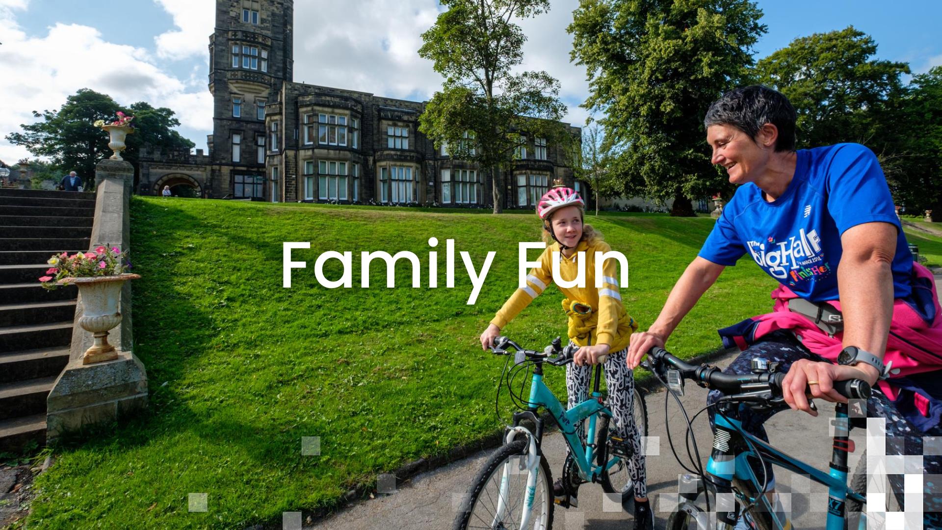 Cycling in Cliffe Castle Park with Cliffe Castle Museum in the background.